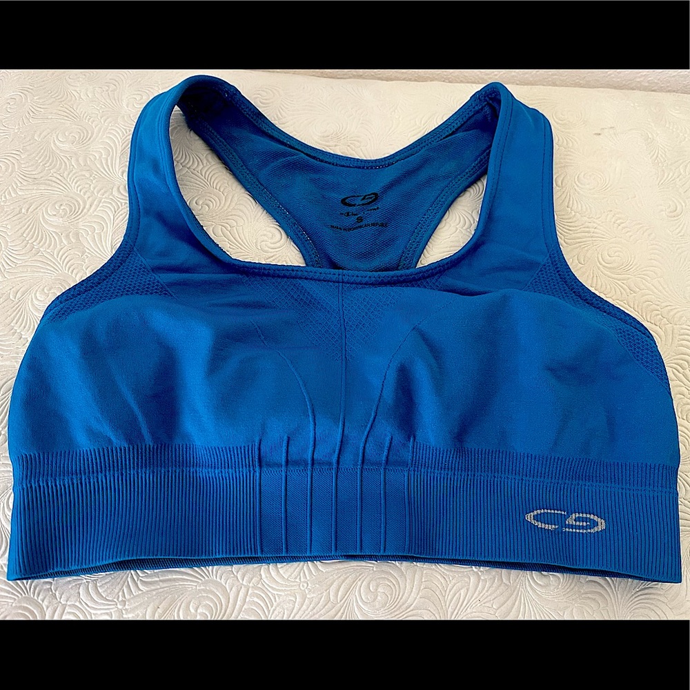 Champion racer back sports bra in deep turquoise. Seamless & lined construction